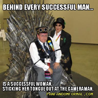 Behind every successful man ... is a successful woman, sticking her tongue out at the cameraman.
